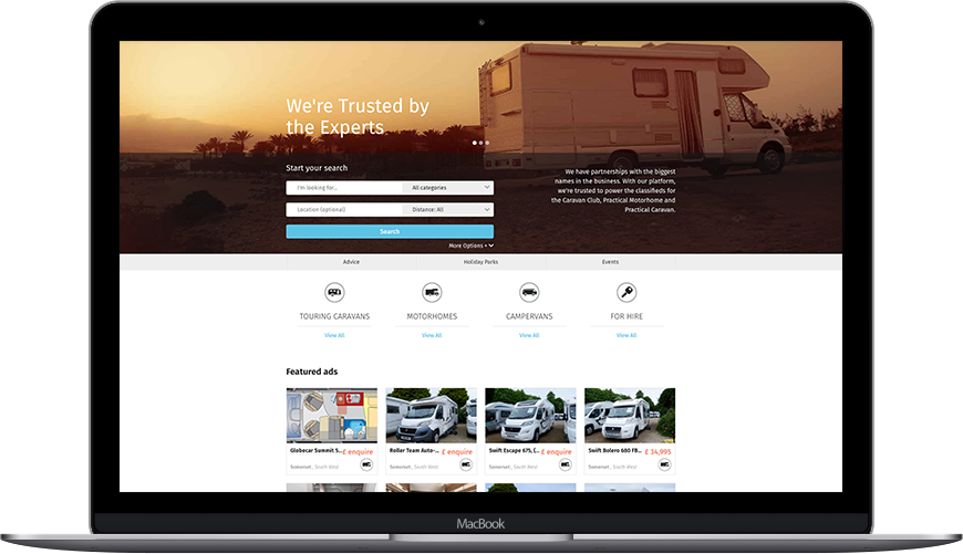 caravans for sale homepage in a laptop